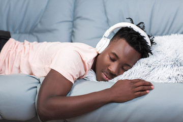 African-American man in headphones listening to music