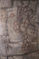 drawing of an ancient cave man on the wall of the cave ocher.