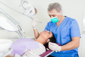 Fototapeta premium dentist professional filling teeth