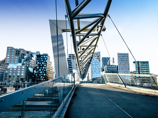Beautiful different modern buildings,  bridge from Oslo's Barcode district rises from the fjord...