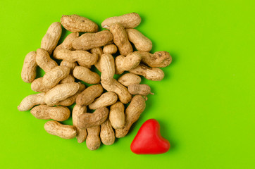 I love peanuts, nuts on a bright green background.