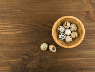 Obraz na płótnie Canvas Quail Eggs on Wooden Background