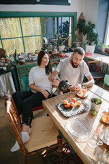 young couple spending time drinking tea and having fun