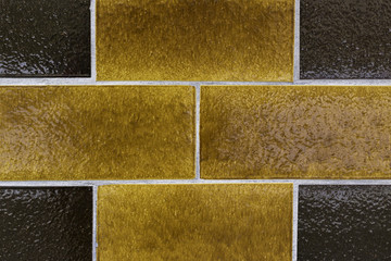 Fototapeta premium Brick wall close-up. Yellow and brown in an interesting pattern. Shot in Stockholm, Sweden.