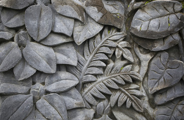 Ornamental bas-relief of a jungle carved in an old tree