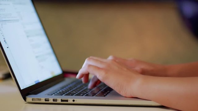 Woman's Hands programming on Laptop at home CLOSE UP. Lady using portable computers. Girl in Interlet. Lady programmer writes code