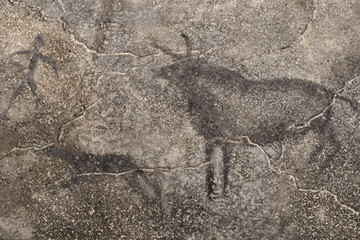 An image of an ancient man, animals on a cave wall. history. archeology. stone Age.