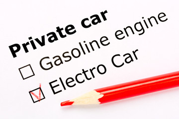 Questionnaire. White paper sheet with checkboxes and red pencil. Survey asks the persons about private car engine: gasoline or electro.