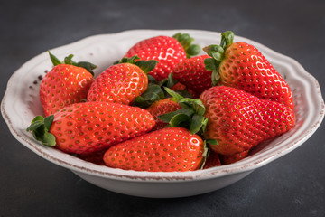 Strawberries on ceramic bowl
