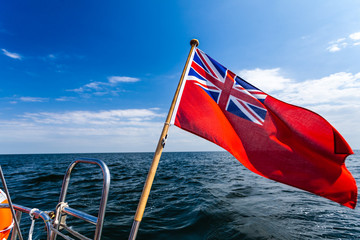 Fototapeta premium uk red ensign the british maritime flag flown from yacht