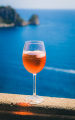 The summer seaview with glass of Aperol 