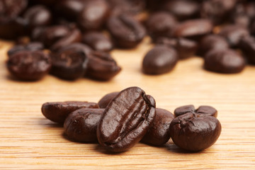 Coffee beans on wood background