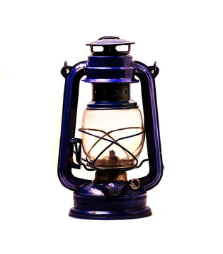 Old kerosene lamp on white background. There is a way