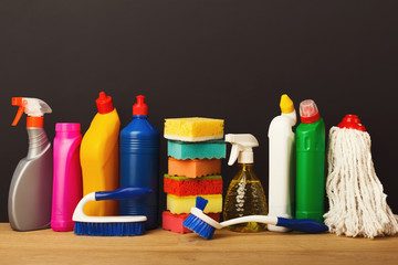 Group of colorful cleaning products on dark background
