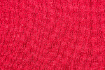 Texture of red knitted fabric.