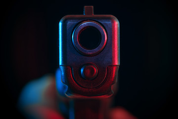 Pistol pointed at point blank range