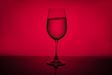 Glass on a red background.