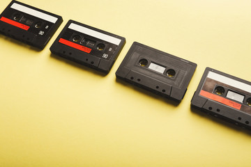 Creative background with audio cassettes of different colors
