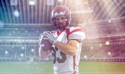 american football player throwing ball