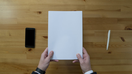 Man holding Blank white paper