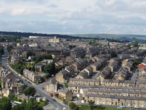 panoramic view of Halifax in west yorkshire with rows of terraced streets buildings roads and surrounding countryside