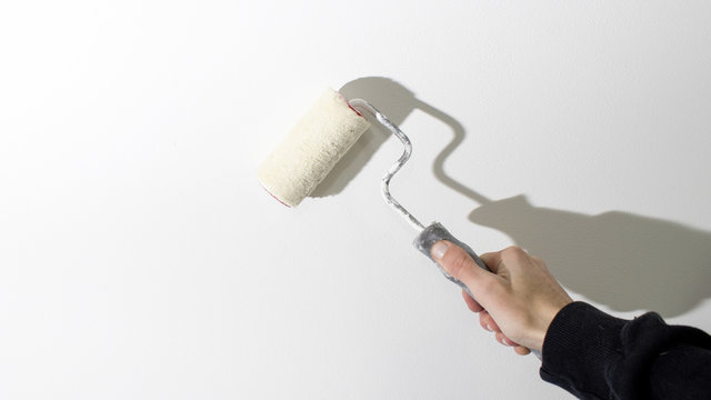 Roller painting white wall