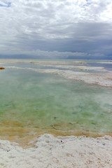 Lowest salty lake in world below sea level Dead sea, full of minerals near luxury vacation resort Ein Bokek, perfect place for medical treatments, climatotherapy, thalassotherapy and heliotherapy.