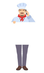 Chef holding white blank poster and talking on the mobile phone