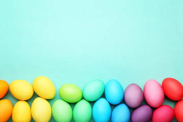 Colorful easter eggs on mint background