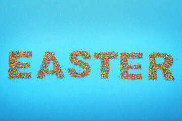 Inscription Easter on blue background