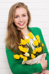 beautiful woman with a bouquet of tulips