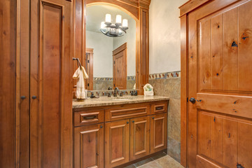 Bathroom with wooden bathroom vanity