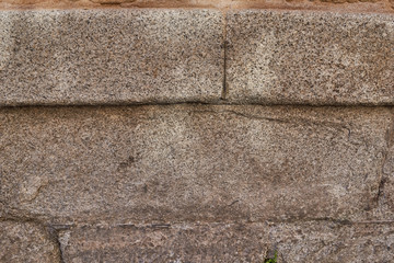 Close up of wall of large gray stones for background or texture