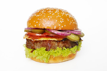 appetizing burger with big fat chop and vegetables close-up on white background
