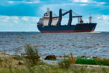 Blue cargo ship underway