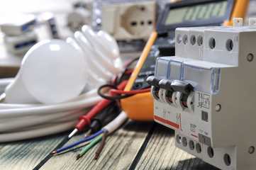 Close-up of electrical components and equipment on aged wooden background