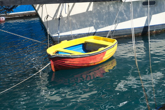 small red-yellow-blue  boat