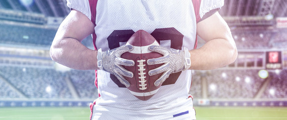 closeup American Football Player isolated on big modern stadium