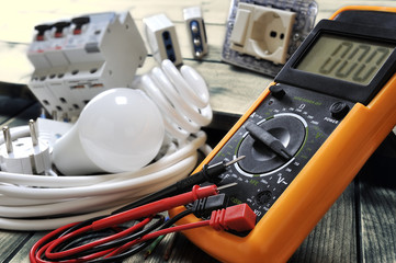 Close-up of electrical components and equipment on aged wooden background
