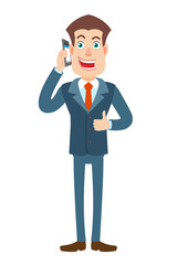 Businessman talking on mobile phone and showing thumb up