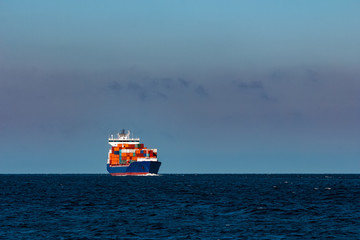 Blue container ship in Baltic sea