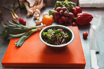 Cooking ingredients for salad and kitchen utensils