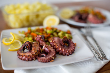 Macro Close up of Octopus appetizer with vegetables