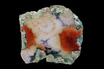 A cross-section of agate. Multicolored silica bands colored with metal oxides are visible. Origin:...