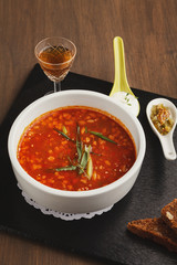 Delicious russian soup with snacks and drink
