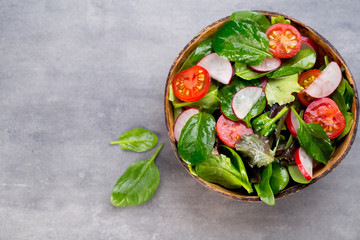 Fresh salad with baby spinach and tomato, radish und salad.