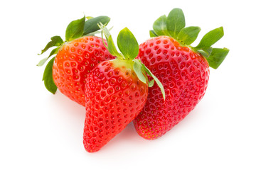 Fresh strawberries close up on white background.