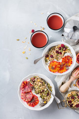 Healthy morning breakfast with granola yogurt blood oranges