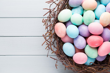 Naklejka na ściany i meble Pastel Easter eggs background. Spring greating card.