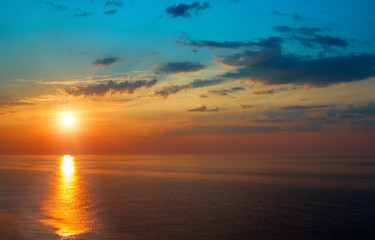 Beautiful sunrise over the quiet calm sea.